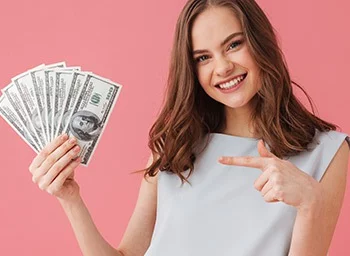 a female blackjack player holding some dollar bills